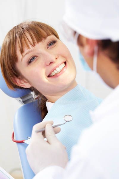 woman smiling during her visit to Universal Dentistry in Abington, PA
