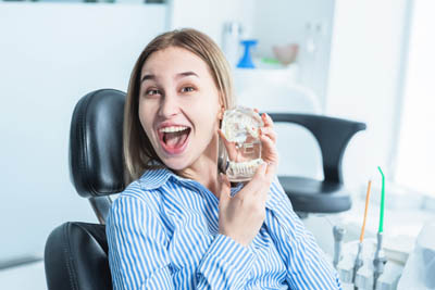 woman smiling during her visit to Universal Dentistry in Abington, PA