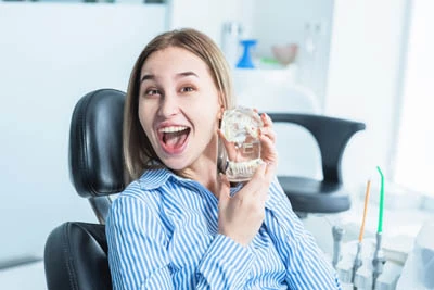 woman smiling during her visit to Universal Dentistry in Abington, PA