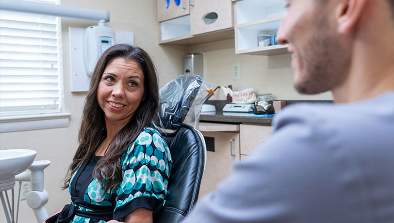 woman smiling during her visit to Universal Dentistry in Abington, PA