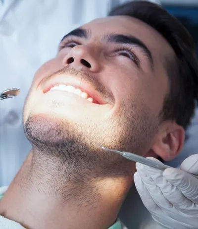 man smiling during his dental care at Universal Dentistry in Cherry Hill, NJ