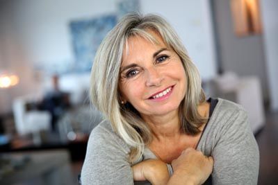 woman smiling with dental implants from Universal Dentistry in North Wales, PA