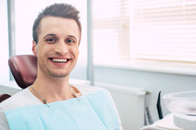 man smiling during his visit to Universal Dentistry in North Wales, PA