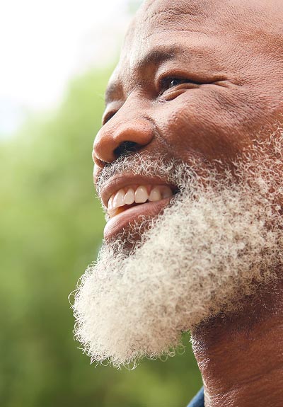 man smiling after his restorative procedure at Universal Dentistry in North Wales, PA
