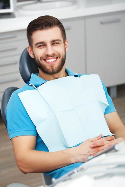 man smiling during his appointment at Universal Dentistry in Turnersville, NJ