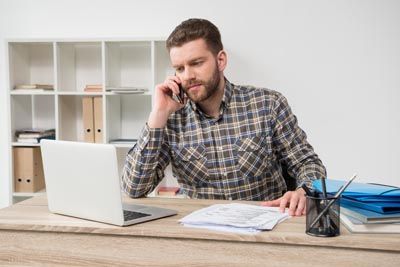 man scheduling a dental appointment at Universal Dentistry in Turnersville, NJ