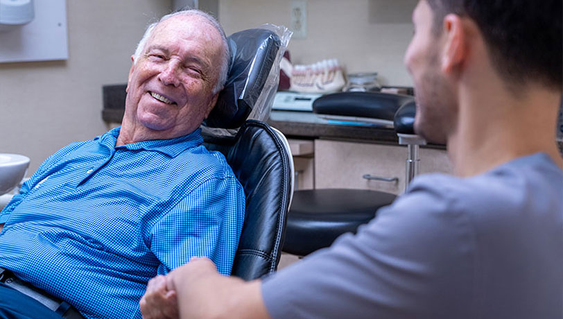 man receiving dental care at Universal Dentistry in Turnersville, NJ