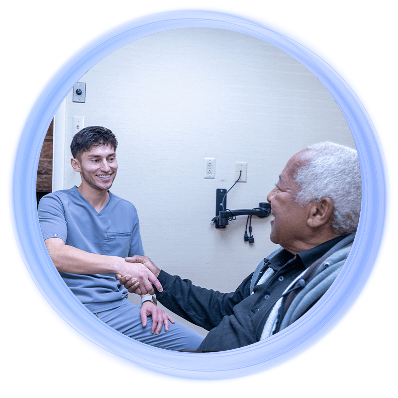doctor shaking full arch dental implant patients hand