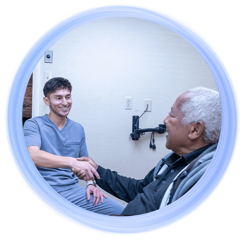 doctor shaking full arch dental implant patients hand