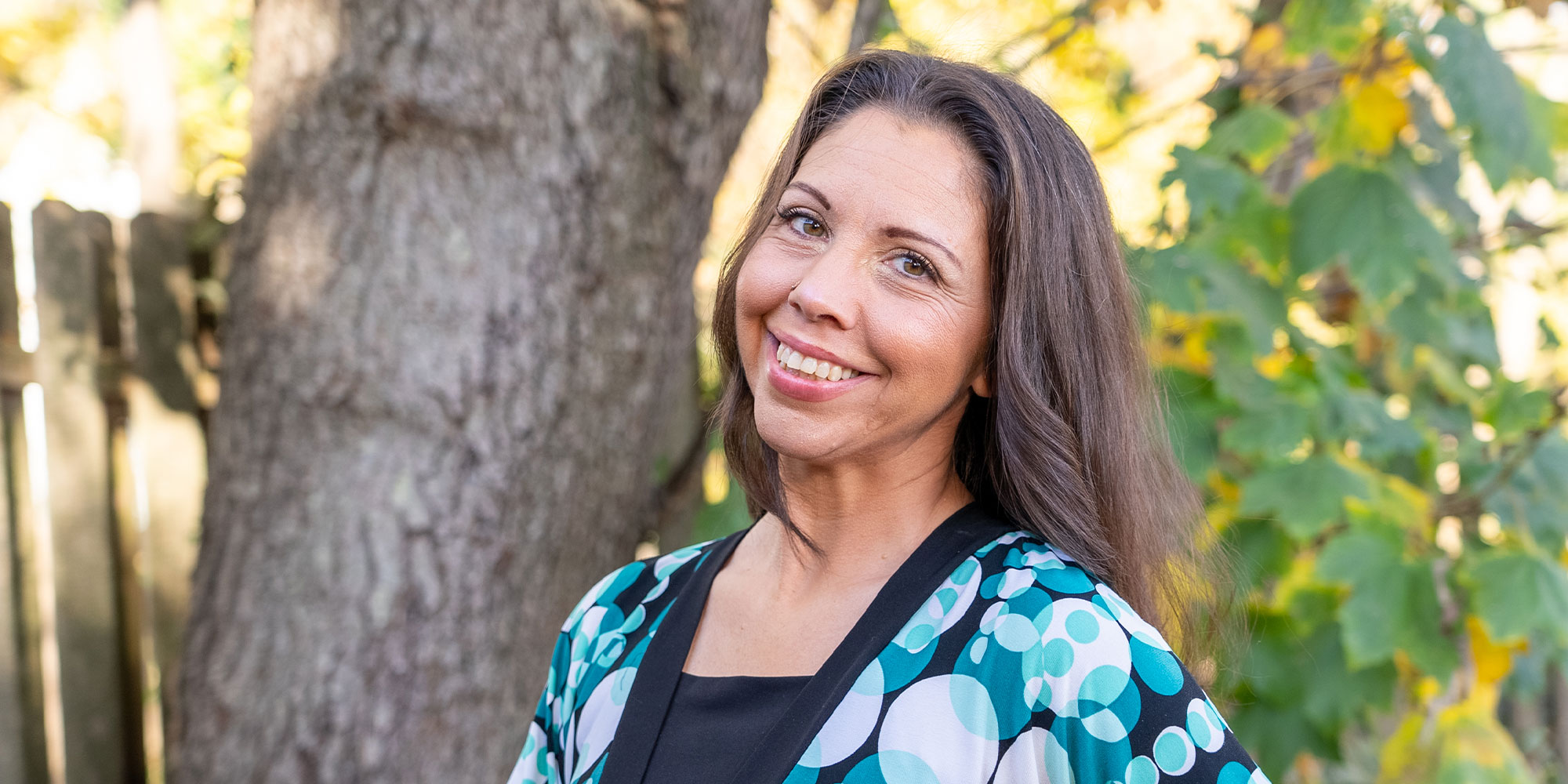 patient happily smiling after cosmetic dentistry