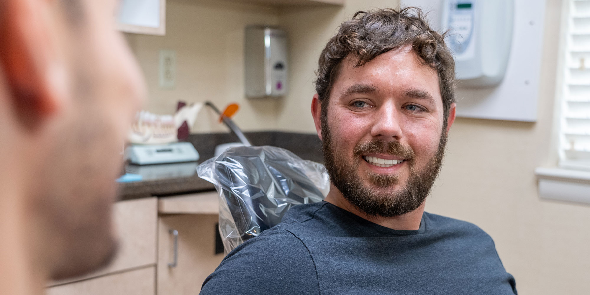 doctor consulting with patient about mini dental implants